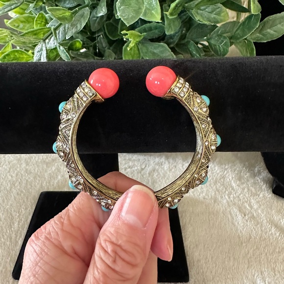 Heidi Daus Coral and Turquoise Hinged Bangle on a Gold toned Backdrop - Picture 1 of 9
